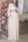 I decided to look for a wrap dress since I'm pregnant and not sure what size or dress would fit my belly lol. First I ordered a medium and it was too small for my chest area so then I went with a large and it fit great! The length was a little long but I didn't mind because if I decided to wear heels it would've been perfect! The arms were a little loose but didn't look bad at all, they were flowy. Lovee Lulus! Always great pricing and great quality. - Fatima S.