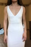 I am obsessed with this dress! I ordered a size XS in white for my wedding next year. It is too long which was to be expected, but it is also not as tight as I was hoping so will need it to be taken in slightly. I plan on dressing it up with a long veil. It is the same style of dress I was originally looking for, at a fraction of the price! Very high quality, classy, and gives an hourglass shape! - Jennifer V.