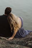 I ordered this at the last minute for my engagement photos after returning several dresses. It came 1 day before and I'm so glad it did! It's definitely low cut and the top was a little loose, but you can pull it down to where it fits without getting it tailored. It flows so beautifully and the denim blue color was lovely. I'm not sure I would wear something like this in real life, but I loved it for photos. Credit to Nicole Ashley Photo for the pictures! - Susanna B.