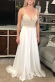 I ordered this dress and another to try on for wedding dresses. This one is really beautiful and high quality. I ended up going with the other one (which was a lace style so very different). This one would be perfect if you're looking for something: elegant, simple, classy, unique, or a little glamorous. The dress was comfortable. I didn't wear it too long, but the rhinestone top didn't seem to both my inner arms. The back is gorgeous also, and feels so elegant! Additionally the bra cups are not as noticeable in person as in the Lulus photos. I recommend trying this dress! - Lauren E.