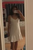This dress is so pretty and it does look really good on. I just wish it was a tad bit shorter, but I'm sure if I was a bit taller this wouldn't be an issue!! I got a size small. - Meena K.