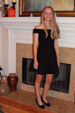 My daughter wore this dress to her homecoming dance this year, and it worked perfectly! The dress fit true to size, she normally wears XS and Smalls.  Cape sleeves added an elegant touch to the dress and stayed put on her upper arm, didn't continually fall down.  The material is great (not itchy, as she puts it!) and easy to steam/iron and wash.  This dress easily dresses up or down with accessories and is the perfect "little black dress" for all occasions. - Susan S.