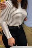 This top is a staple. Can go with almost anything. I'm normally a small, but I ordered a medium based on the reviews. It's does run a little small. Size up, especially if you have a larger bust like myself. - Malena R.