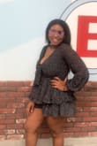 I tried on this romper and I planned to return it, but I was out of Town and I ran out of clothes I tried it on again and it fit wonderfully. I tried it on originally with no bra and just tied it but I wore a bra with it and it fit much better. That bra did show, but it was black so it blended pretty well. - Lindsey W.
