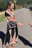 I wore this dress to a late summer outdoor wedding and it was a total hit! So many compliments. I'm super short and had to have this dress shortened by about 3 inches even with heels, thankfully there were enough stripes at the bottom not to loose the pattern there. I have B1/2 to C cups and there was no way the girls could have hung free in this dress, they would have fallen out for sure. I researched KimK boob tape trick and it worked perfectly with sports tape, look it up! - Mary M.