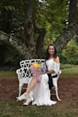 The dress was exactly what I wanted. It's very flowy and soft. The slit hit me about 2.5" above my knee which made it sexy but not inappropriate. I am 5'1 so I did have to get the dress hemmed even with my 4" heels. But I am use to that. - Patricia D.