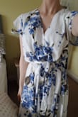 I'm devastated over the size of this dress. It's not true to size at all. I ordered an extra small but it's ginormous on me (I also ordered another dress from here which is extra small and fits me perfectly well).

Looking at other peoples' reviews, and how their dresses fit perfectly well, I think I may have somehow been sent a defective dress!? The label says it's extra small but there's no way that it is. It's frumpy, ill-fitting and I think I look like I've been swallowed by a curtain.

It's either a defective dress or there's a vast unreliability between the sizes within the company.

The customs charge to get it delivered to the UK was Â£40 so it wouldn't even be worth returning for a refund. What a huge waste of $96. Knowing that the store is unreliable, I won't be ordering from here again. 

I'm so disappointed because I love the pattern on this and I absolutely adore the other dress!! :( - Georgina H.