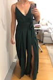 I love that this jumpsuit could be worn instead of a dress for an occasion. I'm usually a medium but the zipper just fit in the back. The neck line and slots are so fun. I am tempted to keep it even though I might not wear it to the occasion I intended to. Note that the legs are pretty wide and roomy. - Lauren L.