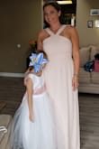 This dress is so pretty fit very well a little tight but sizing up would of been too big, had to hem it due to it being very long even with heels on but other than that I LOVED IT! Got so many compliments - Rebecca D.