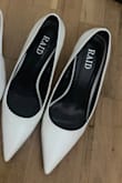Order your normal size. Very comfortable and looks attractive. At first I thought it's a bit funny looking like a clown shoe bc the front pointy part is too long but you get used to it. However, would have been perfect without the awkwardness in the pointy part. - Joy L.
