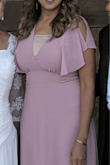 Very beautiful, love how it flows! My family loved it, I wore it for my parents 50 yr anniversary party. Unfortunately, my chest is big and I had to wear a cami to cover it up a bit. Wished it had a bit more fabric in that area. : ) - Ketty J.