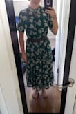 It fit a little loose on me. Adding a belt made it look much better, so I am keeping it. It's also a little long for my height, but it will be good for when I need to dress conservatively or for fall. The green color and the pattern is very beautiful. - Melissa H.