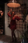 I'm a curvy, tall girl - both bust, butt, and legs for days. So at first I was a little nervous about purchasing this dress because I've tried similar styles on before and they just didn't work out with my body type. If they were long enough, they didn't fit well in my hips. THEN THIS DRESS SHOWED UP! Now, I will be the first to admit that it does fit a little snug in the hips area and doesn't flatter my figure as much as I'd like it to, BUT it's both long enough and I was able to salsa dance the night away in Mexico while in it! I felt so beautiful in the bold red floral print, and the sleeves / neck line absolutely make this dress perfect for a night out. The material feels like a cheaper quality but throw a couple drinks back and who's really noticing? - Emily H.