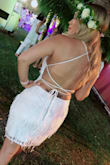 Wore this beautiful dress for my all white diner en blanc event. The strappy back was the best part. Silk dangling accents made it a wow feature. - Angela M.