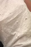 This shirt looks as though a child got scissors and just started cutting. That or a mouse ate the shirt. It's also really small. - Sarah C.