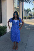 I loved the way it fit. A little loose on the upper body, snug at the waist and enough room for my hips. The wrap dress was pretty straightforward to tie. The neck is deep so I wore a cami inside. What I loved the most is the tiny little tie ups provided inside the dress that helps keep it snug at the waist, since I have a smaller waist compared to my lower body. And of course the color is absolutely splendid, got many compliments for it. - Samyukta B.