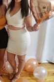 I wore this outfit one night for dinner during my bachelorette weekend and loved it- got a lot of compliments too. The skirt is lined but it's pretty thin, so I wore spanx underneath just for some support. - Courtney D.