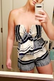 I'm back and forth with liking this romper. I'm a 34D and it's very low cut/doesn't stay up on my bust very well. I tied the bow on the front of it super tight and it helped. Also if you have a long torso/tall like me it's a little short to try to cover your booty while trying to keep pulling up the top part to try to stay covered lol. But overall a super cute romper! - Kaleigh S.