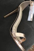 I am a 7.5 in shoes, this style fits true to size. Beautiful rose gold metallic shine. I am not keeping them because they are too high for me and not comfortable in that matter, but is just a personal choice. If you are used to wear high healed sandals, you will find them perfect! - Leticia C.