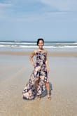 This dress fits me Perfectly. I'm only 5'2" so I'm a little on the short side but with a pair of heels (3-4 inch heels) it hangs just above the ground. If you're short like me and not planning on wearing heels, then I would not get this dress unless you don't mind it dragging on the ground. It's very form fitting and has adjustable shoulder straps. On windy days it's no problem, there's a built in slip under the dress. Every wedding event I've worn this dress to in the past year, I've always received complements on it. I don't even like wearing dresses but this one is a bit of a game changer for me. It's my special events dress that never fails me. - Ariel T.