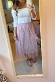 I loved this. It made me feel so feminine. It was a little big, I usually hover between a medium and small. I got a small for this and it was just a little baggy looking but not enough to change the size. Also very comfy and got so many compliments!!! - Erica P.