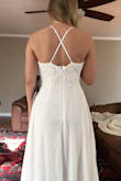 This dress was better than I imagined. Quality and fit. I am having a small wedding and this was the perfect dress for that event. The back is a little lackluster but I decided to add a small rhinestone belt to kick it up a notch. I'm 5'2" and there was plenty of length even if I was 6'2". Again, beautiful dress, highly recommend as a good wedding dress! - Nicole B.