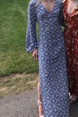 This dress is BEAUTIFUL... Wore it to a wedding that I wasn't too sure was casual/more dressed up. Paired with the right heels it could go both ways. I'm 5'4 and with 3" heels I had no issue with the length. You can tie it front or back and the material is very light - Abby F.