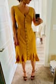 I love how this dress came in at the waist. It's great for the hourglass body type. Tasteful at the chest area, pulls in at the waste, and falls at the hips. It has a little bit of a high-low cut at the bottom. Love the ruffles edge at the bottom too! - Emily F.