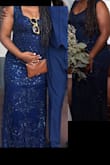 I wore this dress as the maid of honor for my sisters wedding. I received lots of compliments. This is really a beautiful dress.  Dress was a little long but I wore high wedges with the dress. - Sonya B.