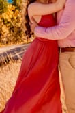 I bought this in an XS, and it was still very long, the shoulder straps fell a few times, and the breast part was quite loose. However, I paired it with some stilettos and wore it for a fall engagement shoot. The dress is beautiful and looked very elegant in the shots. - Bree W.