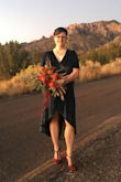 My fiance and I had a non-traditional desert elopement and I wore this dress for the occasion. Although I had to pin the bust so that it did not show too much cleavage, I received a ton of compliments and felt very pretty. The quality is just OK...there is a small hole in the bust seam after one wear, but it did not expose my bra and was only noticeable to me. Beautiful color and love the velour feel. - Nicole N.