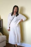 I thought I wouldnt like this for the price it was but I'm happy I did. It goes perfectly with the white pleated skirt i got from here. It's not itchy and doesnt feel cheap at all. - Arleen B.