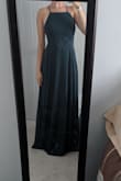 This dress is very beautiful and fits very well. I'm a consistent small, and small fit perfectly. It's not tight or anything. My only complaint is that the colour is not very green! I was thrown off by the title and colour shown in the photo, and was surprised to receive a dress that was more blueish green than dark green. It has a lot more blue undertones and should be advertised as such. So if you're looking for a full green dress, I suggest looking at their emerald option as this definitely has a blue tint to it. Photo attached. - Julie B.