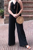 Loved this jumpsuit! Can be casual with flats or dressed up with block heels and a cute purse. I'm short so needed to have it hemmed first. Can't wear a bra with it, but that was no problem with pasties. Only complaint is that despite steaming it right before wearing it, it got SO wrinkly throughout the day since it's linen. Still super cute though. - Mandy G.