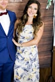 I wore this dress to a friend's wedding and got so many compliments! The back is complicated to lace up so you will definitely need some assistance. For my body the dress fit perfectly except for how long it was. With heels it was barely do-able but I did not have to have it shortened (I wore 5 inch heels for the wedding). Also with a 34D I didn't even have to wear a bra, petals or anything. Perfect, perfect! - April L.