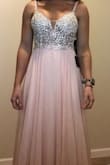 I got the pink one, it fits beautifully.
I may have to get the dress hemmed because I am wearing very small heels for my wedding, but I think it's gorgeous.
I tried to get an up close picture of the front for you.
Great quality as well. - Danielle H.