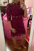 This dress is beautiful. Does not have much stretch to it but a small fits me perfectly. The color is vibrant and the style is sexy but conservative at the same time. Very flattering. Bright color, magenta. Paired it with a nude heel. This is me trying it on, but not all put together. - Kaitlin B.