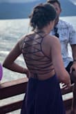 I order this for the gorgeous back detail. Was a little snug but just tied the ties a little loose. Length was perfect for me because I'm super tall. - Mili R.