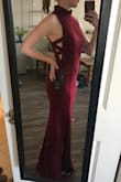 This dress is gorgeous, the perfect mix of sexy and classy. The hips were snug and fit just right, but the bodice was a tiny bit loose. I had to have it taken in a bit, which is tricky due to the cut out at the side seams. - Nella G.