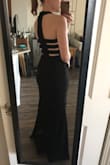 This dress is perfect in every way.  Dresses are usually big on me, but this one is very snug which is probably a sign that it runs small. There is a thick extra layer from the hips to mid-thigh, almost like built in spanx. - Nella G.