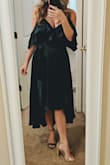 This dress is stunning! I'm so excited to wear this to an upcoming fall wedding. The fabric is very silky and it drapes beautifully. It is a little loose around the chest area, but that's easily solved with the adjustable straps and a bit of fashion tape. Choosing between Lulus heels in the pic, not a sartorial choice! - Olivia B.