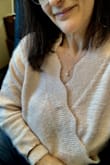 Super soft, luxurious sweater - not too bulky, perfect weight for chilly days and the sweetest pink ever. However! The snap button that holds the surplice together is visible as a little bump right smack in the center of the "V". I can live with it, but it's pretty obvious. Still, it's not enough for me to not want to pair this sweater with jeans or a pencil skirt...versatile and - did I mention - incredibly soft? Very feminine! - Melina I.