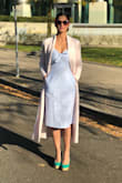 I just loved this dress. I wore for a breakfast party and it just looked ravishing. Got so many compliments. The material is good and compliments the body. Very comfortable. Neck to me is pretty sexy. It for sure deep but doesn't look bad. It goes perfectly with the design. Oh yes! And the pockets ... so much awesome!!! - Rosie B.