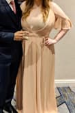 This dress is beautiful. The material is heavy and lays perfectly. The waist was very flattering and the sleeves on the arm were beautiful. 

However, the sizing was way off. I've always ordered XL dresses from Lulus, including wrap dresses, and this is the first that didn't fit at the chest. I had to buy a bandeau to put on under this because it was so small in the chest. The waist fit perfectly, but the bust area had more than half my
Boobs exposed. Had I had time before the wedding I ordered the dress for I would have returned and gone with something else. As it is, I didn't have time for that and had to wear something under. 

So beautiful material. I'd you're very thin and/or have a small chest I'm sure this is lovely. But medium to big boobs should skip this dress unfortunately. - Sophie M.