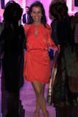 Such a beautiful dress and the color is absolutely gorgeous!!! Dress fits true to size. I wear a size 0 and ordered an XS. In a world where everyone wears black to a wedding I wore this red /orange dress and received many many compliments, even from my Mom. This dress is definitely a head turner. My husband loved it too! - Darlene V.