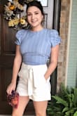 Love this top. It fits great, but is kinda awkward and the sides because of the gap in the back. It just doesn't hug my sides. If I tie it super tight, it does look better. Wouldn't get anything smaller though because it does fit good everywhere else. - Clare G.