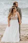 I ordered several dresses to try on for my wedding and I wasn't expecting this one to fit me. I never thought I'd feel the "this is the dress" moment, but I absolutely did! We had a beach ceremony and OH MY GOSH when the wind blows- this dress looks magical! So many guests were shocked when I said I found this at Lulus! I had it altered just a little. They shortened the front of the dress so it'd be easier to walk and they tightened up the straps so the back wouldn't scoop (cheap alteration!) Such a gorgeous dress!!

I ordered several other Lulus dresses (bachelorette- bridal shower) and they all tend to run a little big so if you're hesitant- at least try it out and return if necessary! - Star C.