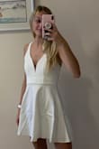 When looking at other reviews I was worried that the dress would be a thin cotton material, it definitely is not! It's a thick, stretchy, cotton material! It is so comfortable! Definitely will need to be steamed before it's worn (this is right out of the package) but it is perfect! - Riley P.