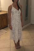 I purchased this dress for my rehearsal dinner and I absolutely love it. It does fit longer on me than the model pictured, but it still fits very well. I ordered an XS and it is a tad tight around my chest, but not enough to go up a size. - Alyssa B.