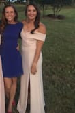 Wore this and got a ton of compliments! The sleeves stay up and the material is a bit stretchy so I would order your true size. Fit perfectly. I am an athletic build and was nervous the off-the-shoulder would look bad, but it worked perfectly! - Jenna B.